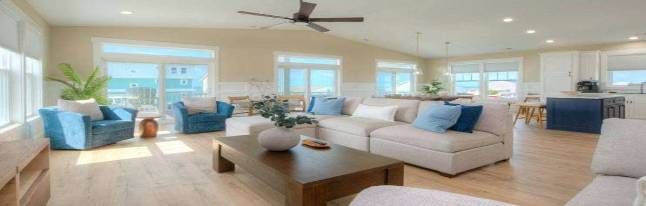 elegant oceanfront pool, tranquil oasis, water shimmering gracefully, photorealistic, overlooking the endless horizon, highly detailed, crystal-clear reflections, shutter speed 1/250s, azure blues, bright midday sun, shot with a 70-200mm telephoto lens.